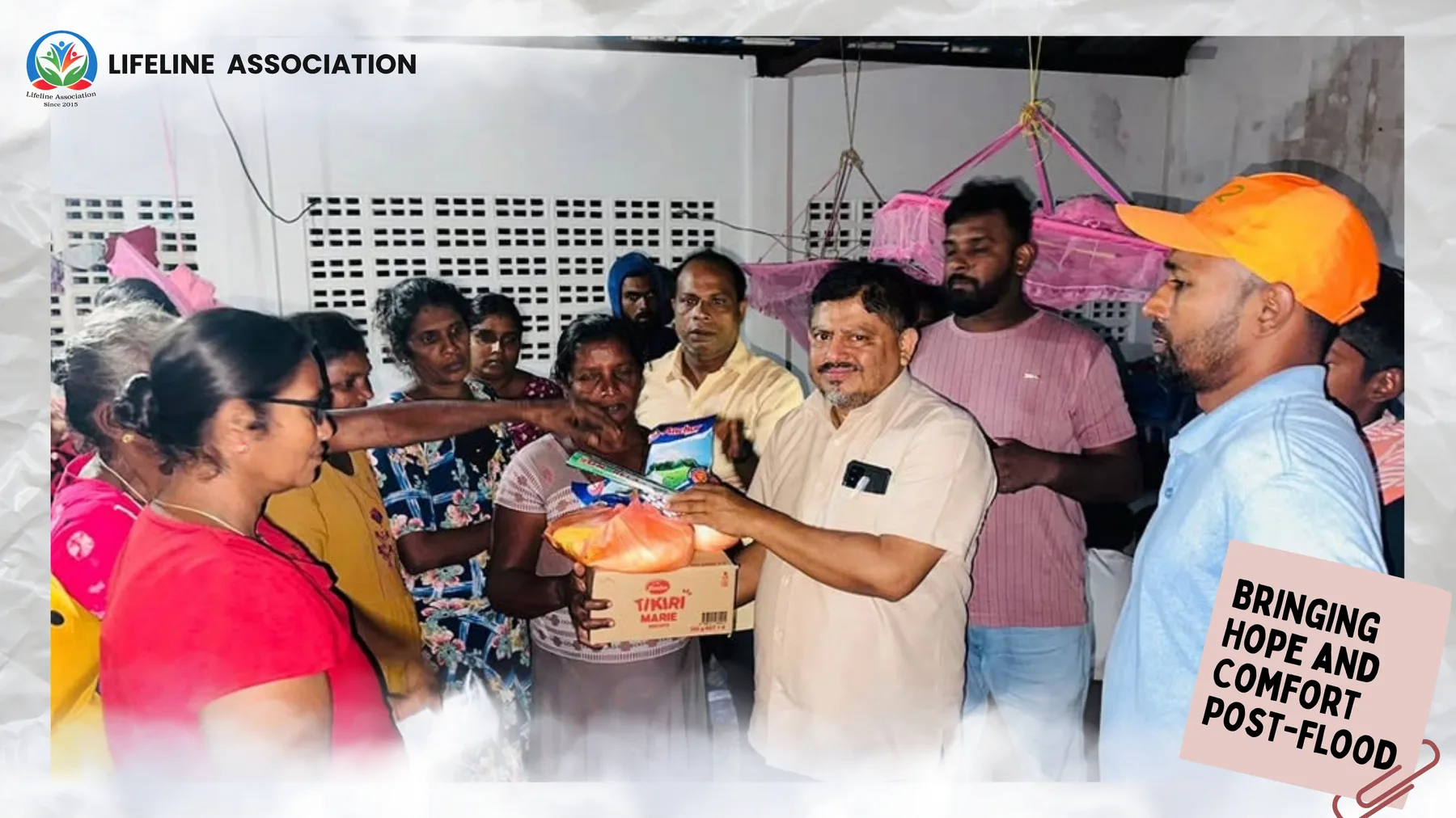A relief package being handed to a woman in the affected community