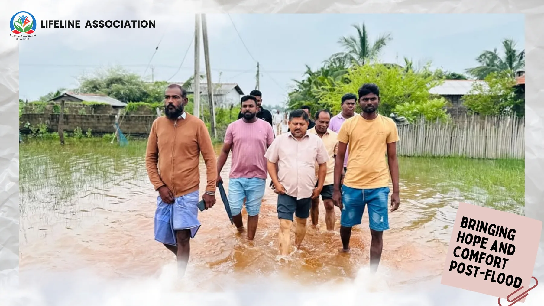 Lifeline representatives walking through floodwater during the first post-flood visit