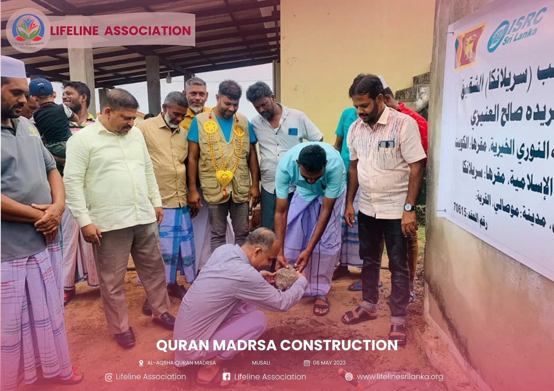 Community representatives gathered beside the madrasa project sign