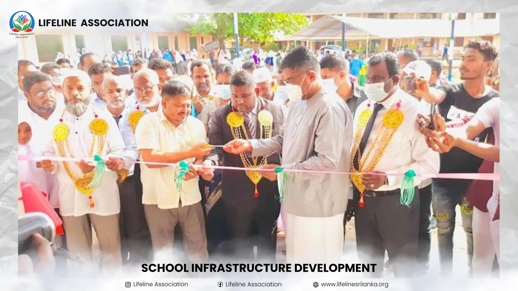 A ribbon being cut at the opening of the school facilities