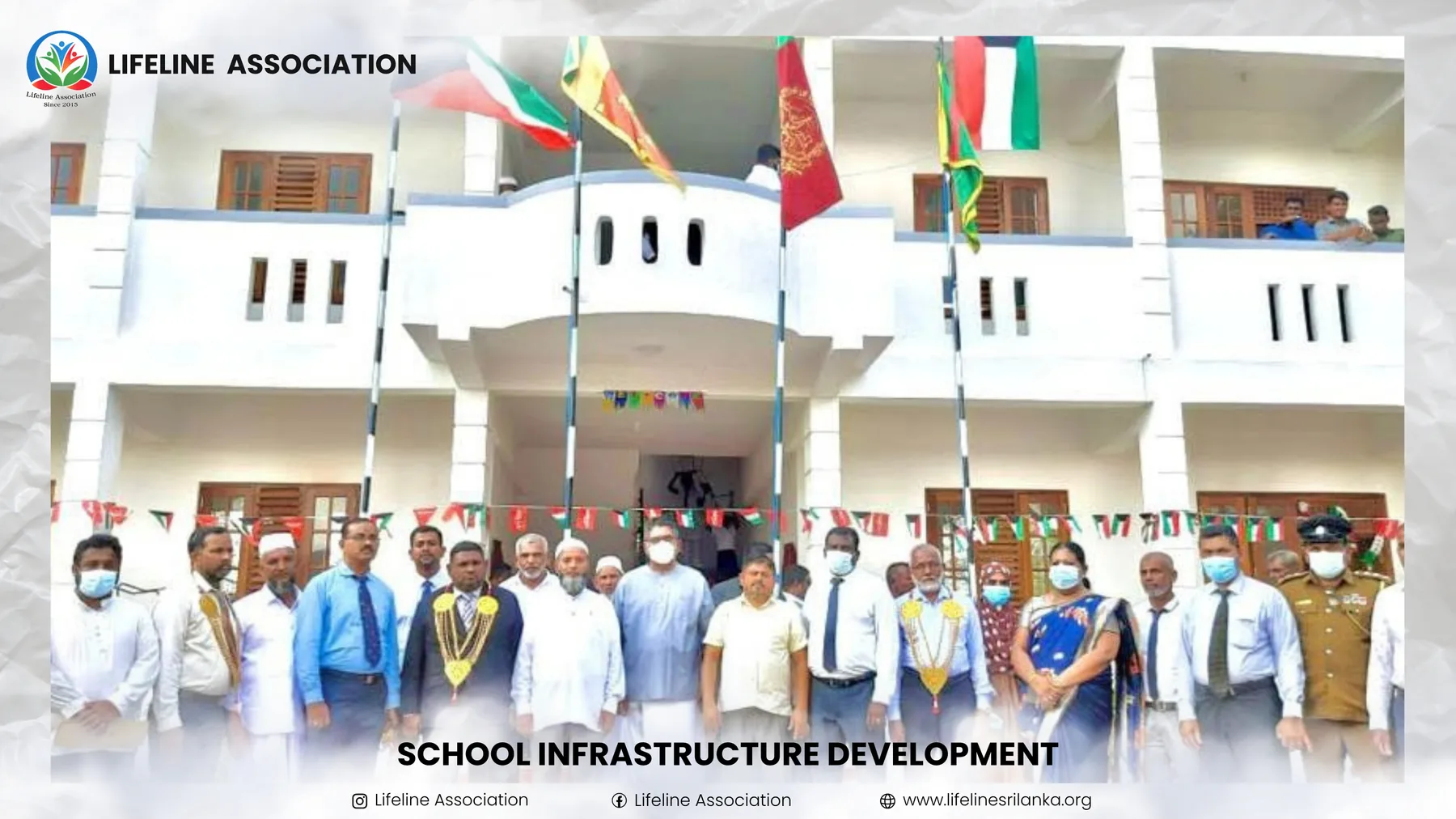 Students and representatives gathered in front of the developed school building